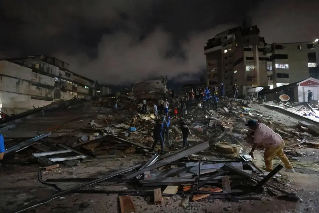 Rescue workers search through the rubble after an earthquake in Caracas, Venezuela.