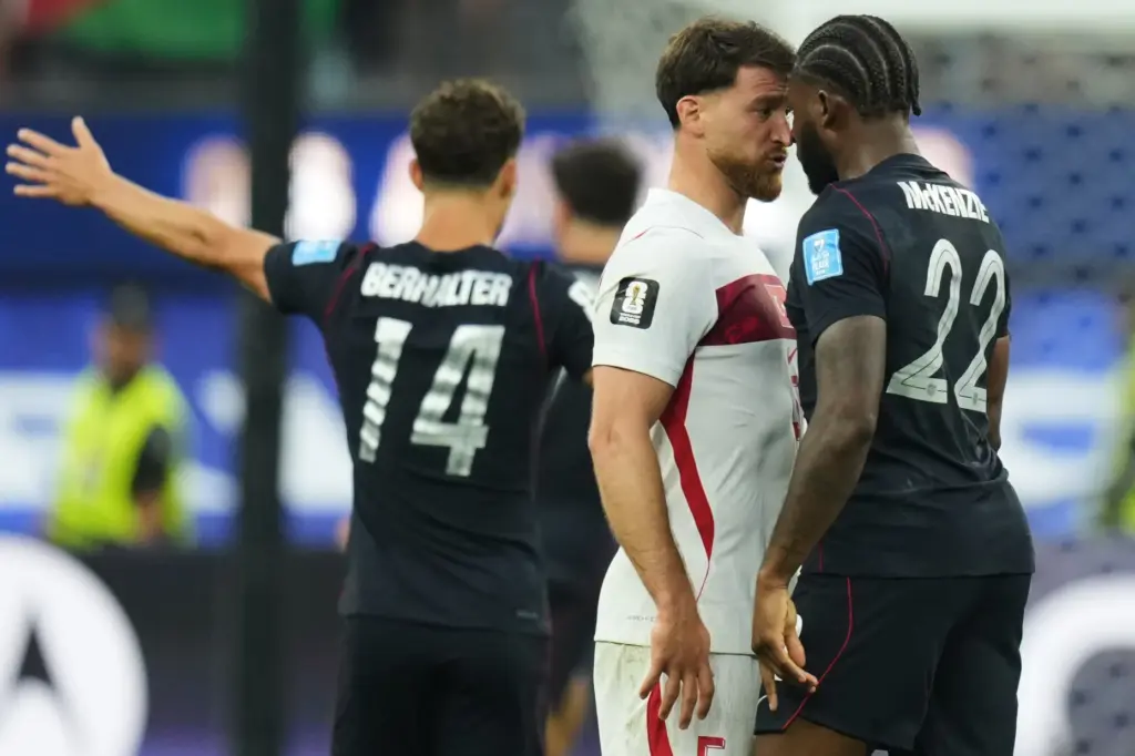 United States’ Mark McKenzie (22) and Turkey’s Salih Ozcan stare...