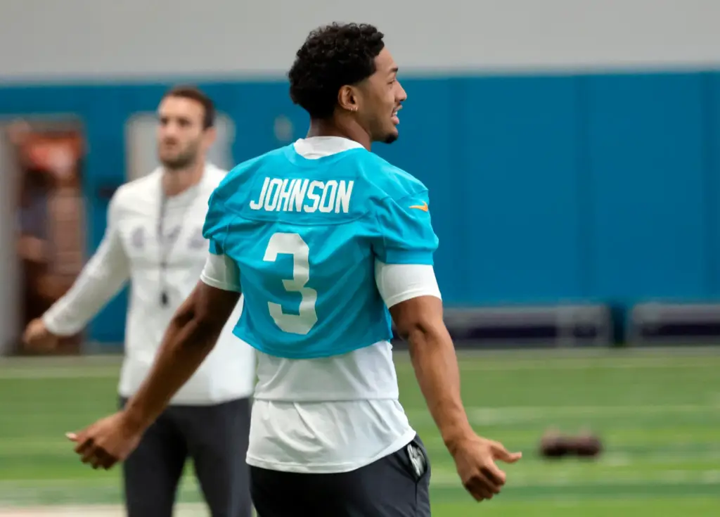 Miami Dolphins running back Chris Johnson stretches during mandatory minicamp...