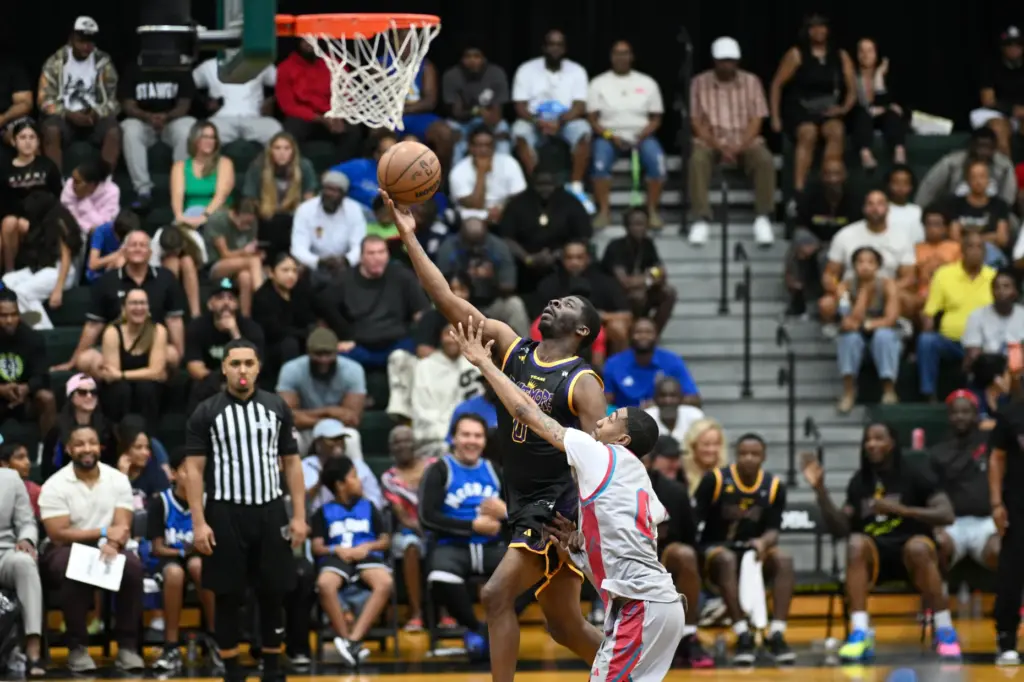 Baltimoreâs Terry âT-Hosleyâ Hosley, left, goes up for a shot...