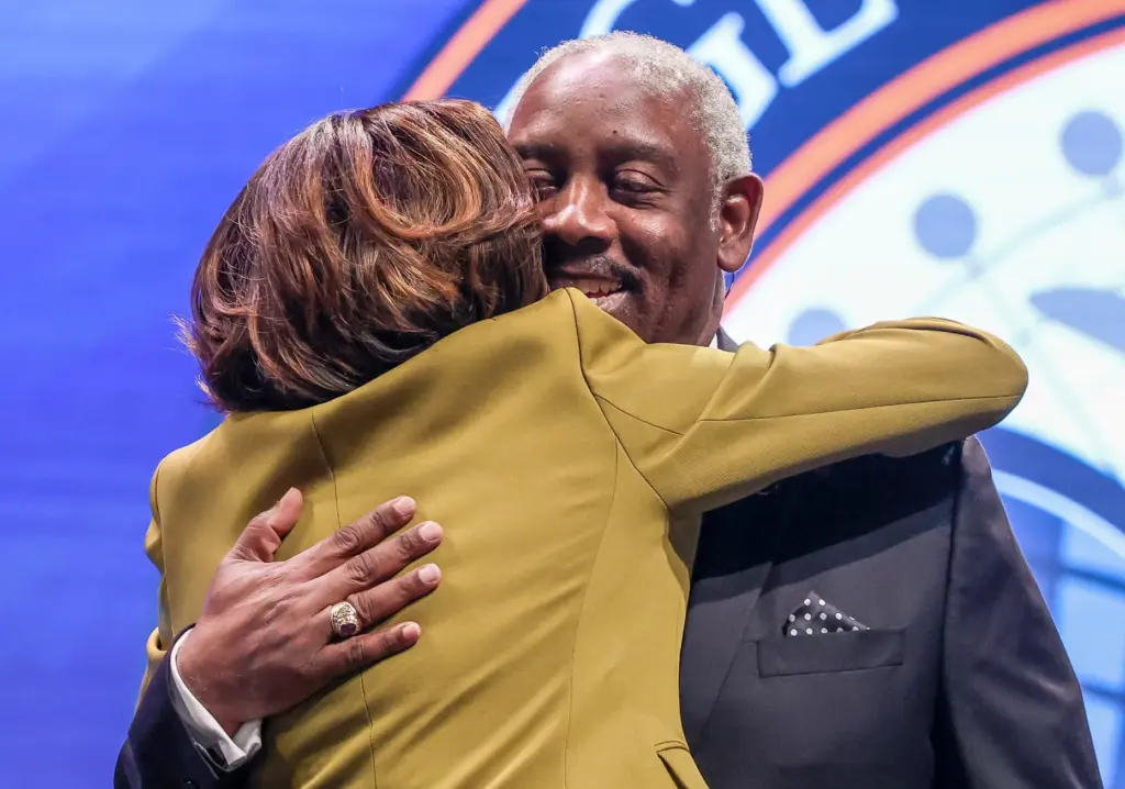 Orange County Mayor Jerry Demings gets a hug from Val...