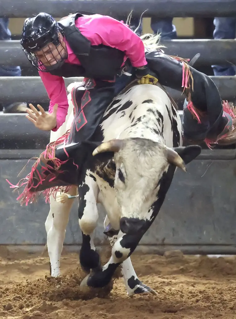 Dallen Baucom rides a bull during the Silver Spurs Rodeo...
