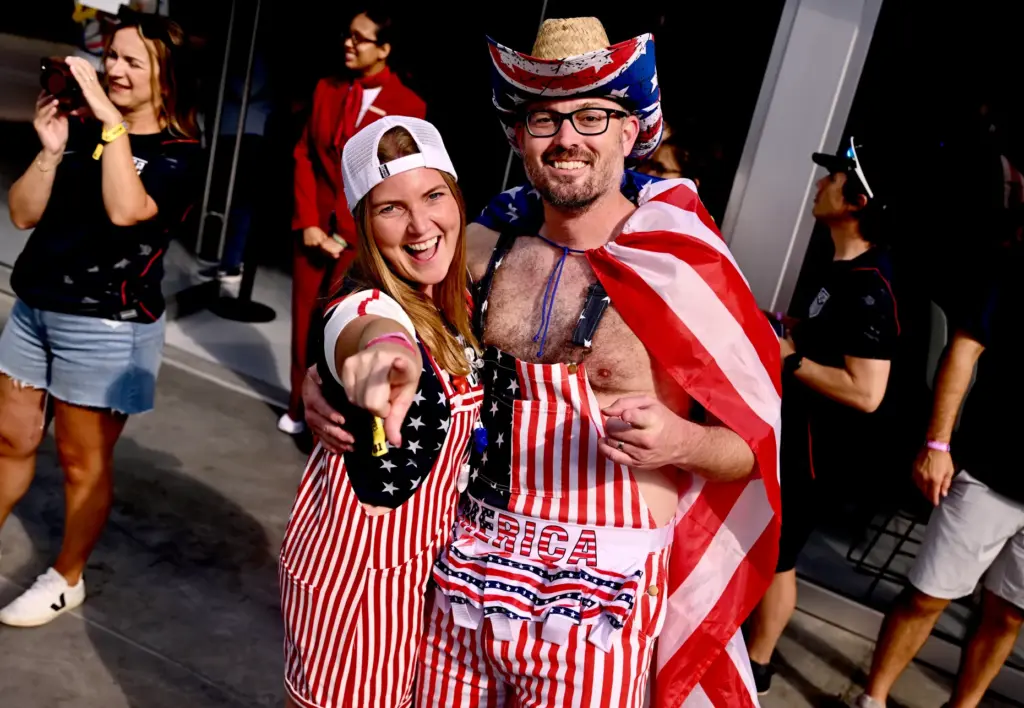 United State fans Adam and McKenzie Flanagan of Nebraska came...