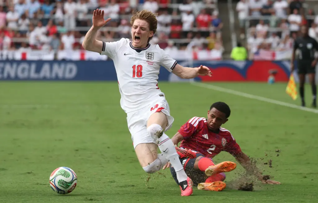 England player Anthony Gordon (18) is fouled by Costa Rica...