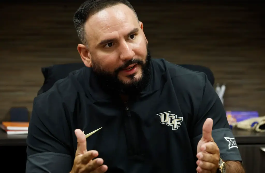 UCF women's basketball coach Gabe Lazo in his new office,...