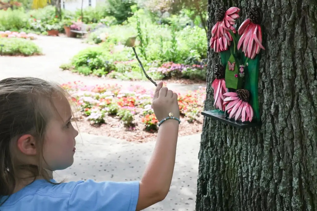 A visitor to the gardens attempts to open Mariposaâs fairy...
