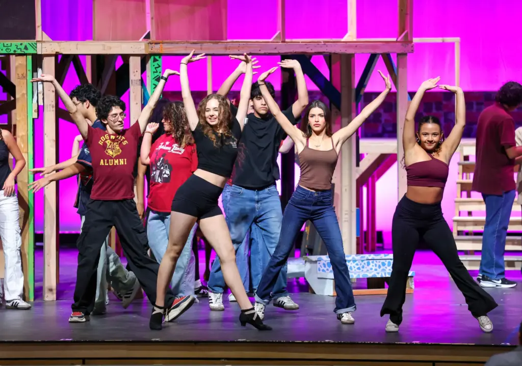 Students perform in a dress rehearsal of the Orange County...
