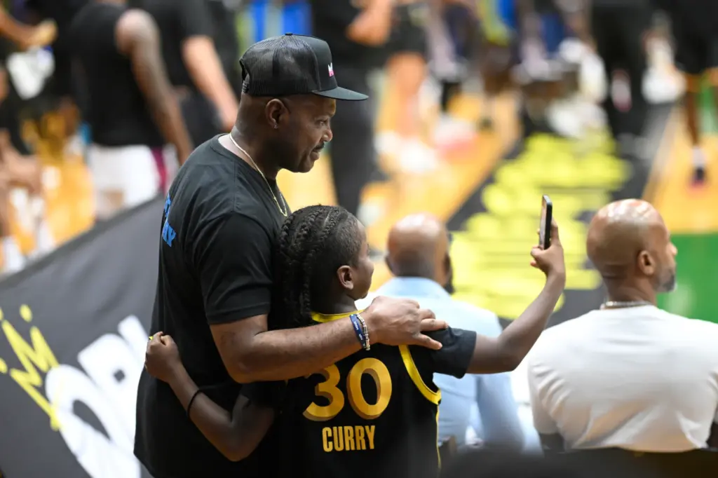 Team Miami owner Tim Hardaway Sr., left, poses for a...
