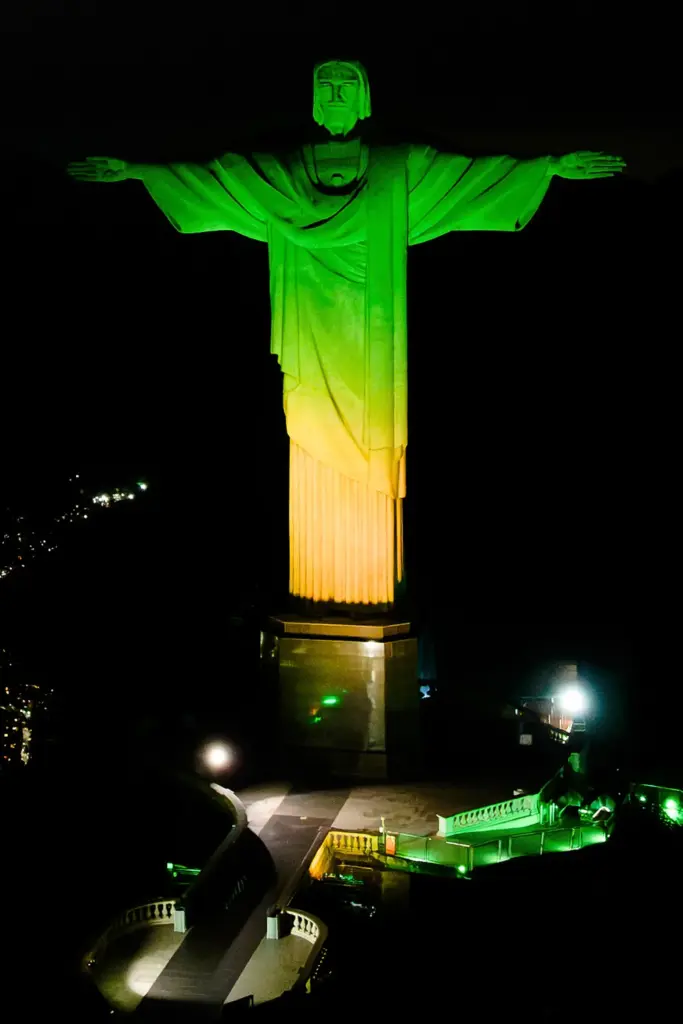 Christ the Redeemer monument is illuminated in Brazil’s national colors...