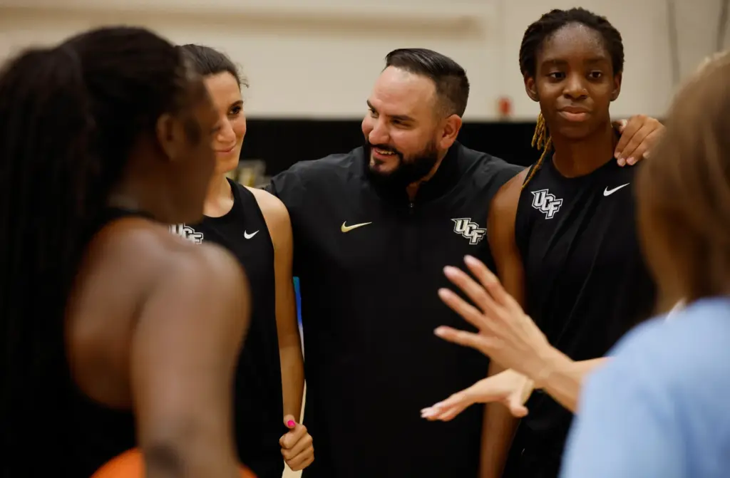 Guard Vittoria Blasigh (10); UCF women's basketball coach Gabe Lazo;...