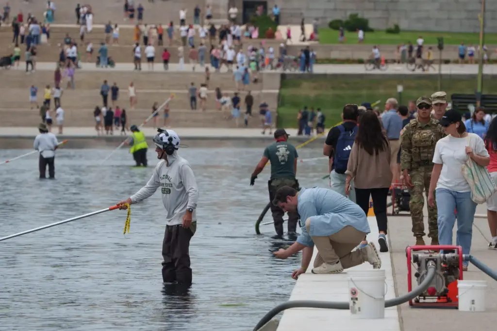 A visor takes a photo as National Park Service employees...