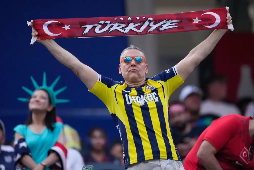 A fan displays a Turkey’s scarf a World Cup Group...