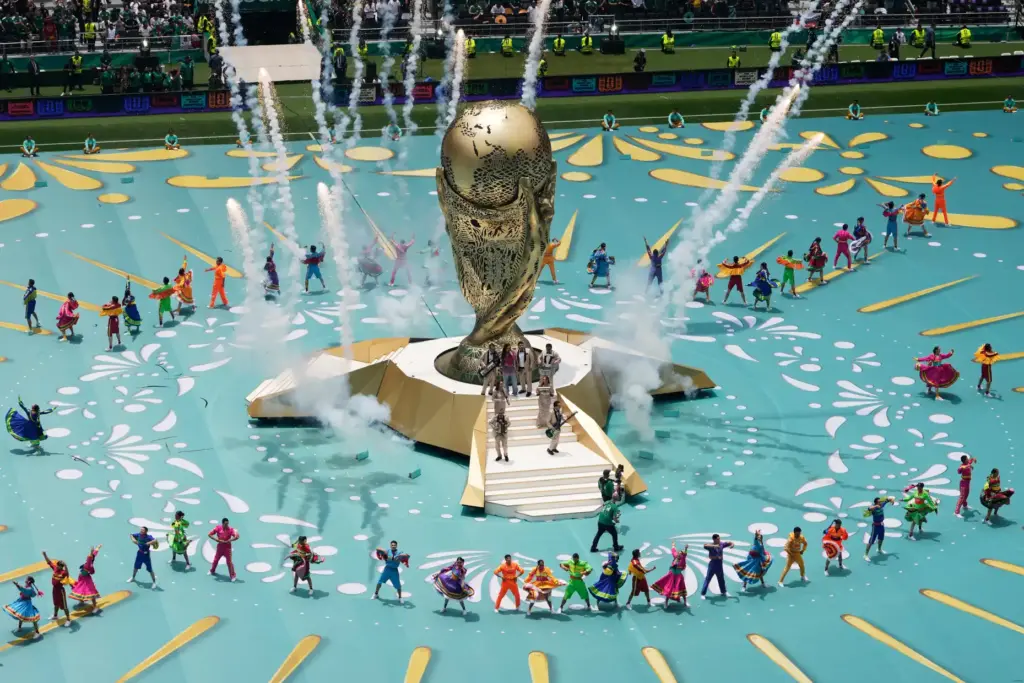 Performers on the pitch during the opening ceremony before the...