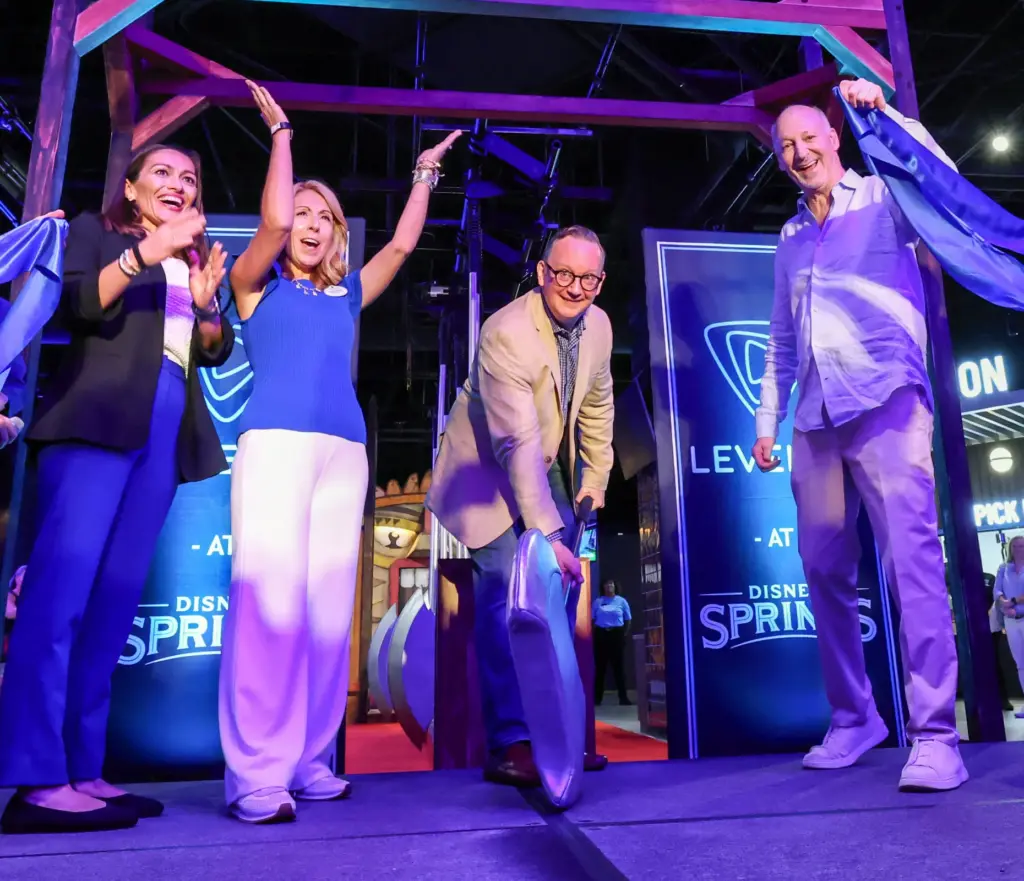 Level99 and Disney executives cheer as CEO Matt DuPlessie, center,...