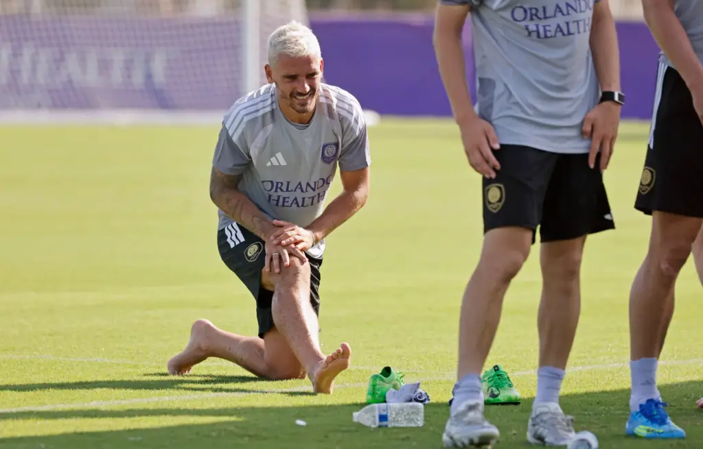Orlando City's newest international star, Antoine Griezmann from France, stretches...