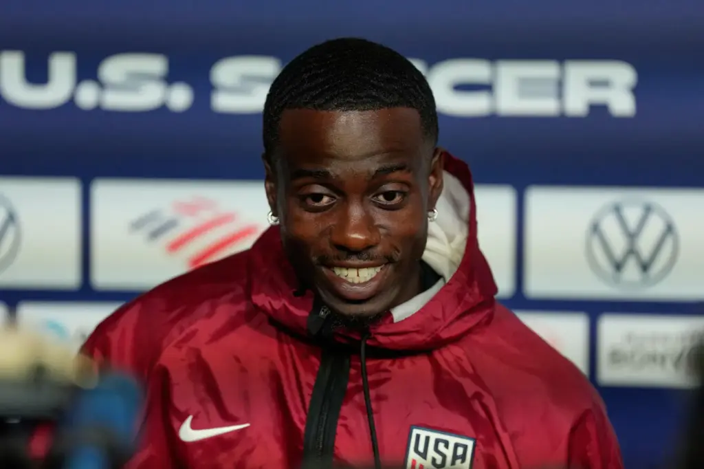 United States’ Timothy Weah speaks with the media before a...