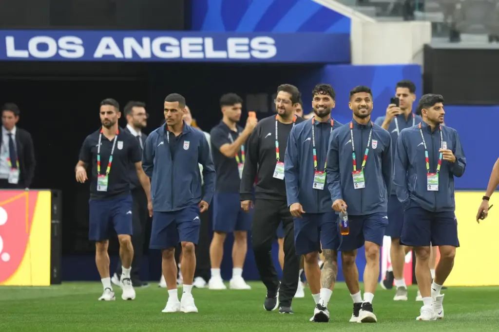 Iran players walk onto the pitch at the stadium one...