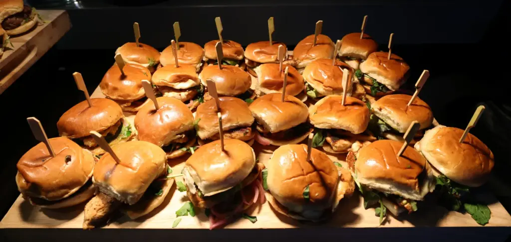 Grilled chicken sliders are served during the preview event at...