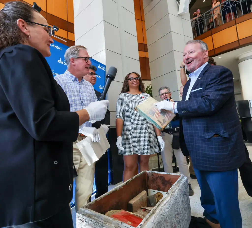 RETRO REVEAL â Orlando mayor Buddy Dyer notices the 305...