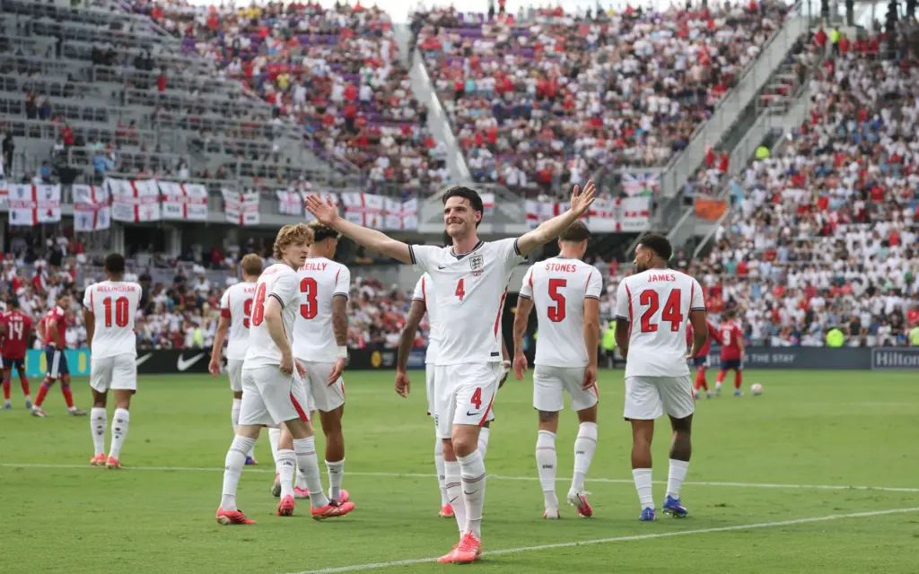 England player Declan Rice (4) cheers after a goal during...