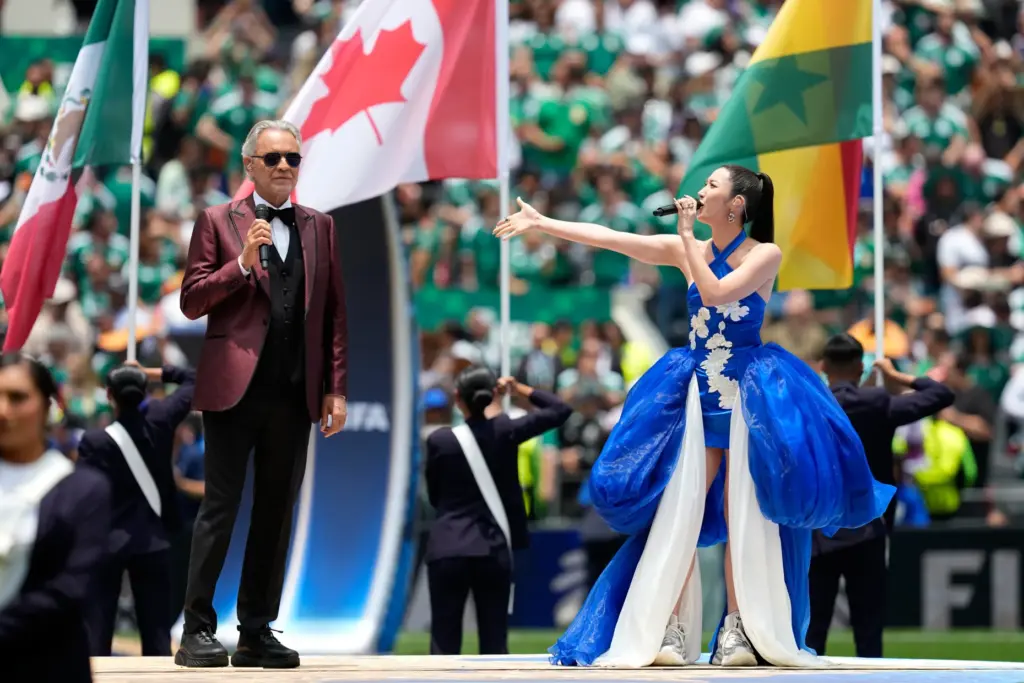 Andrea Bocelli and South Korean singer EJAE perform during the...