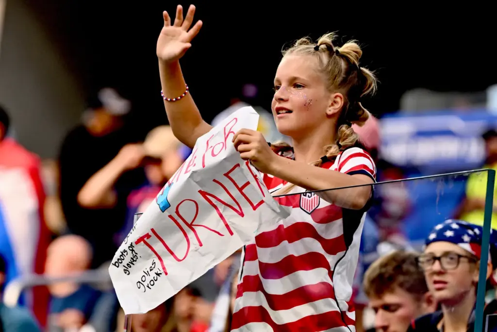 A Cameron Turner fan of the United States waves prior...