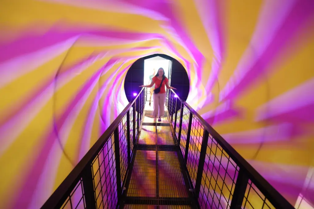 A guest enters a spinning display during Orlando Science Centerâs...