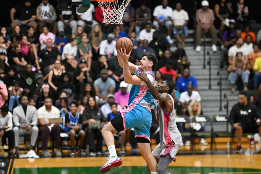 Team Miamiâs Josmel â305Bucketsâ Martinez, left, is fouled by Chicagoâs...