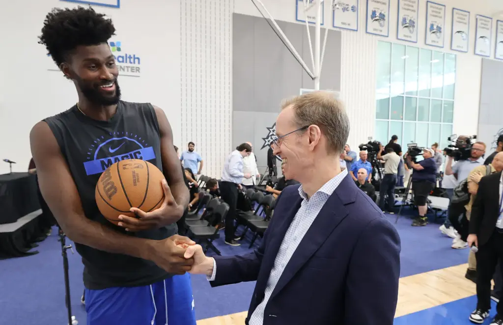 Orlando Magic forward Jonathan Isaac and Magic president Jeff Weltman...