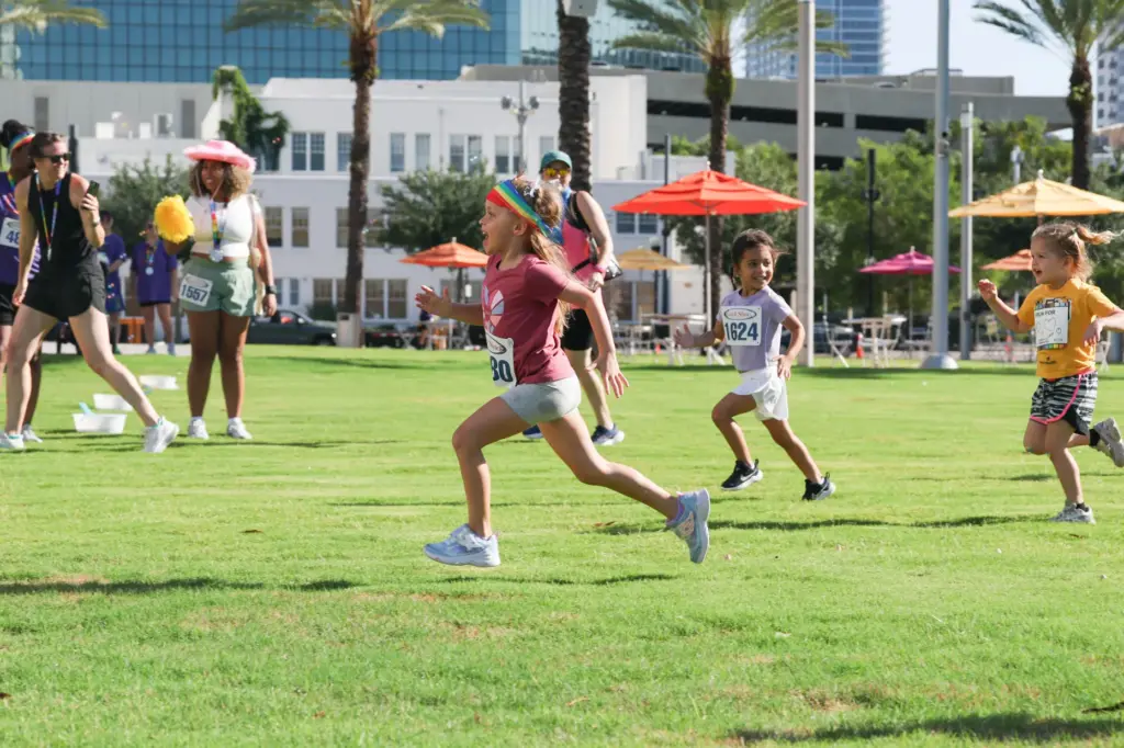 Runner takes the lead at the Kid Run during the...