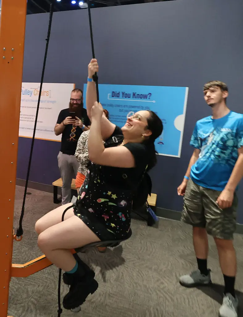 Guests enjoy an interactive exhibit during Orlando Science Centerâs Science...