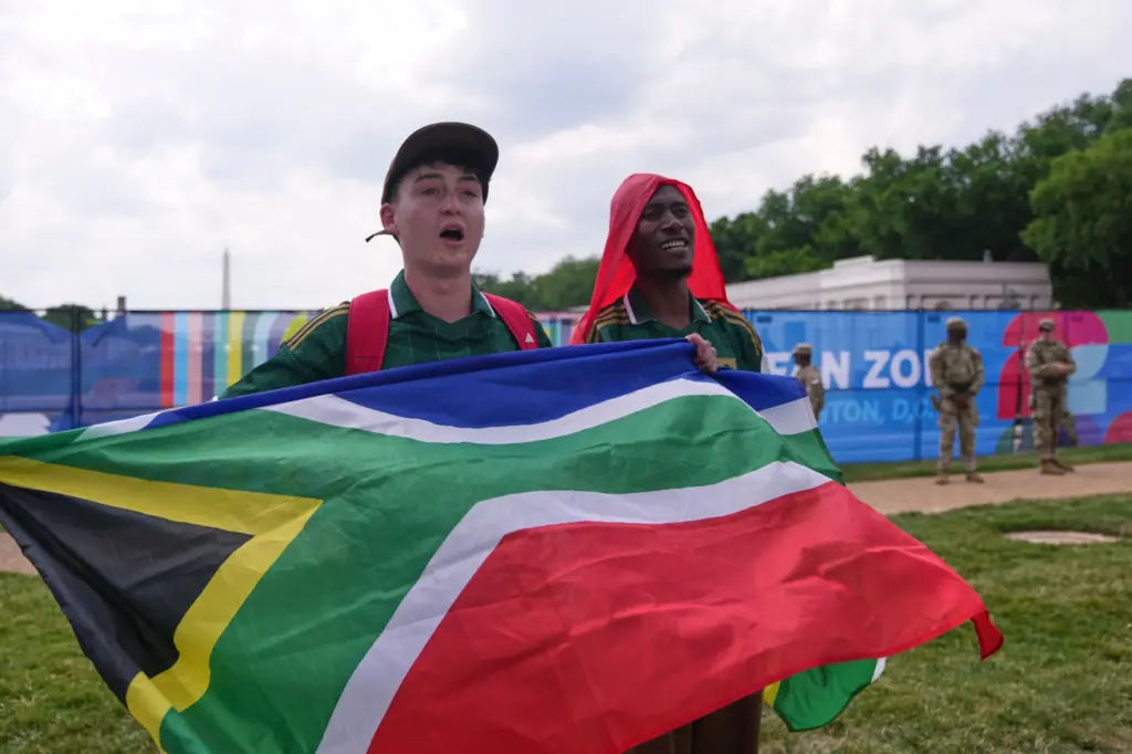 Fans gather to watch the first match of the World...
