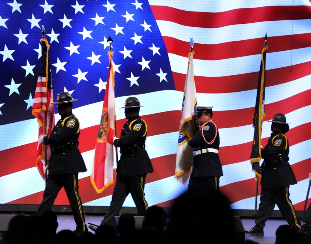The Orange County Joint Honor Guard guard presents the colors...
