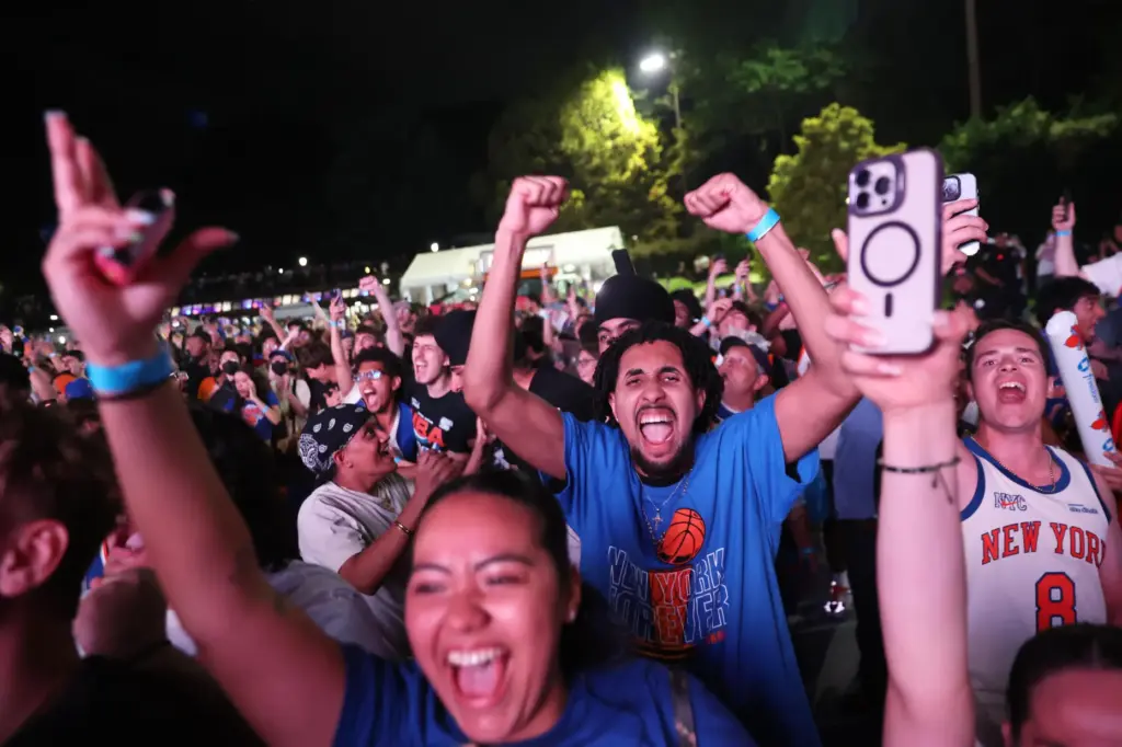 New York Knicks fans celebrate during a watch party inside...