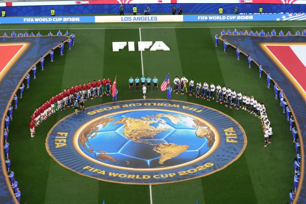 The United States and Turkey pause on the pitch during...