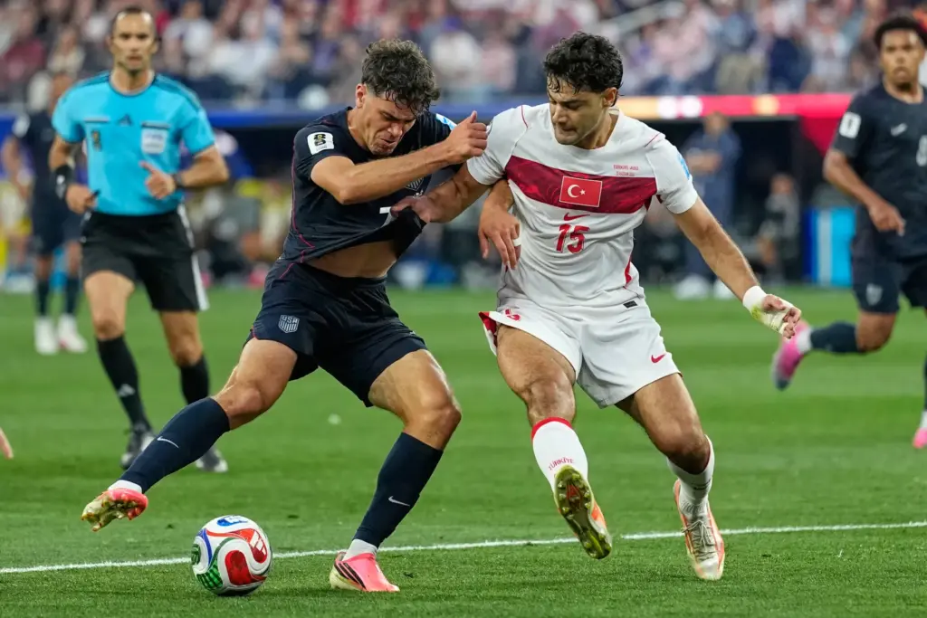 United States’ Giovanni Reyna (7) and Turkey’s Ozan Kabak (15)...