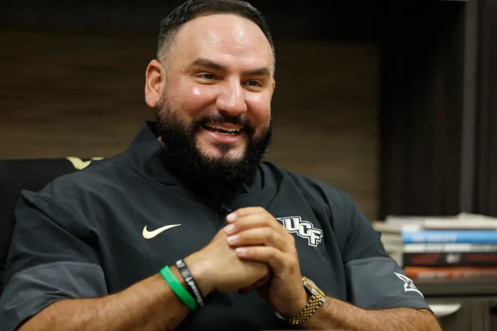 UCF women's basketball coach Gabe Lazo in his new office,...