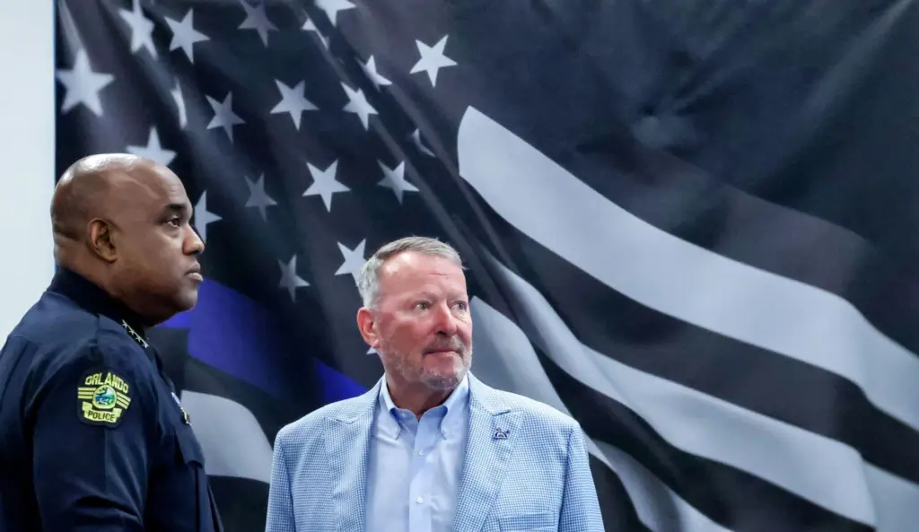 Orlando Police Chief Eric Smith and Mayor Buddy Dyer prepare...