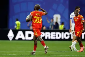 Congo rallies to a 3-1 win against Uzbekistan to seal place in the World Cup knockouts