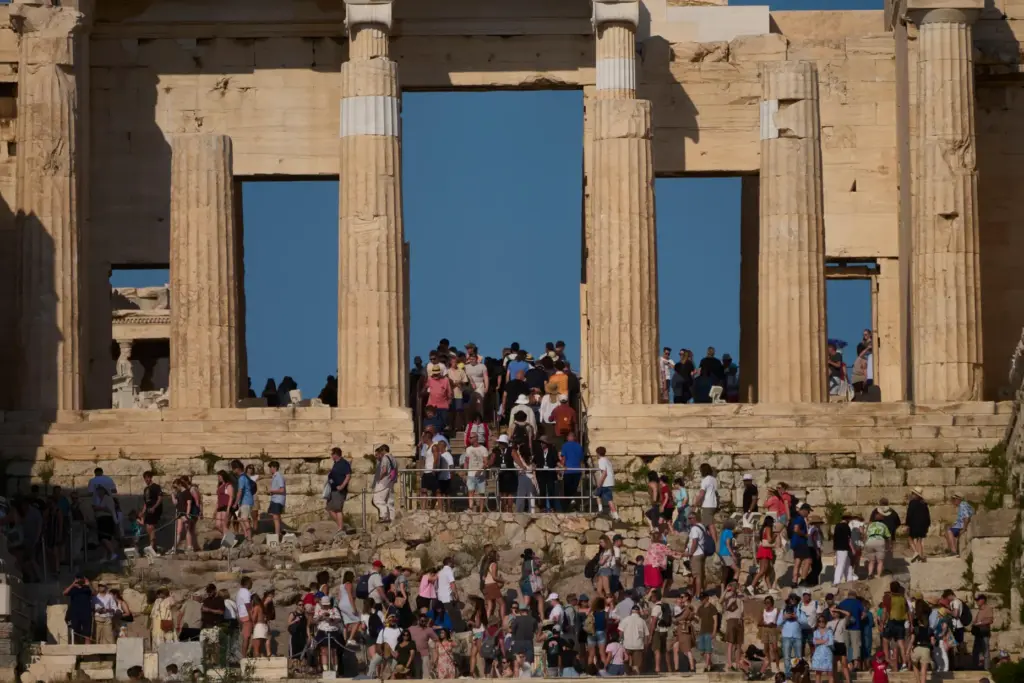 Tourists visit the 5th century BC Propylaea on the Acropolis Hill.
