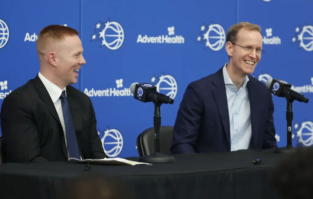 New Orlando Magic head coach Sean Sweeney, left, and Magic...