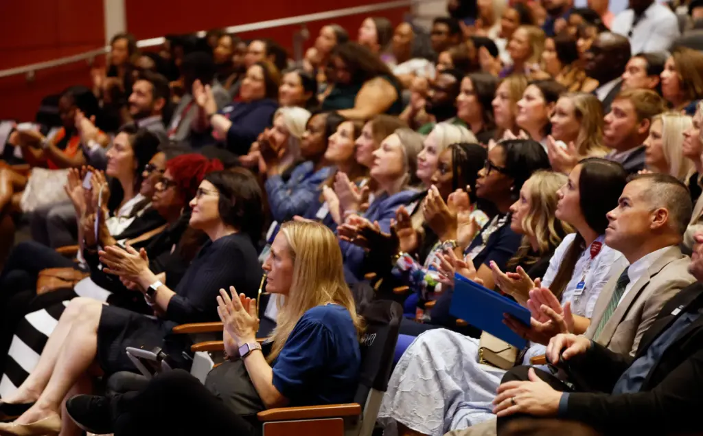 The audience claps during the Orange County Schools 2026 State...