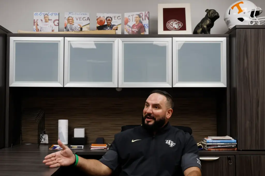 UCF women's basketball coach Gabe Lazo in his new office,...