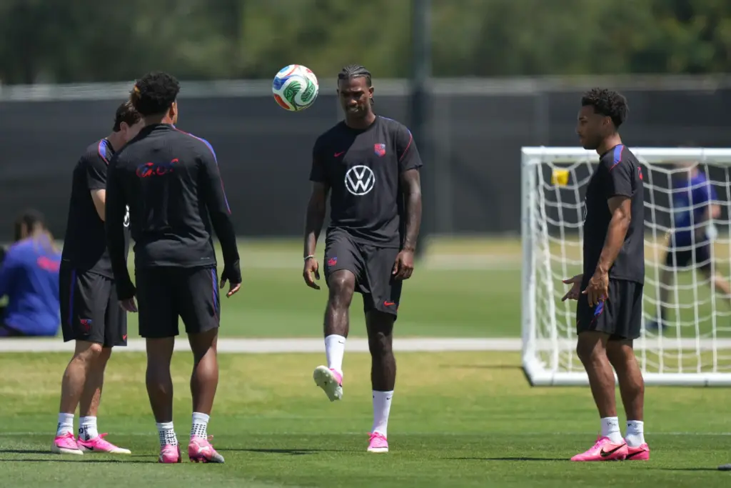 United States’ Haji Wright, center and teammates attend a training...