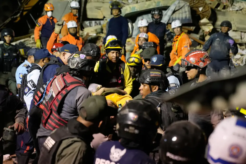 Rescue workers search through the rubble of a collapsed building after an earthquake.