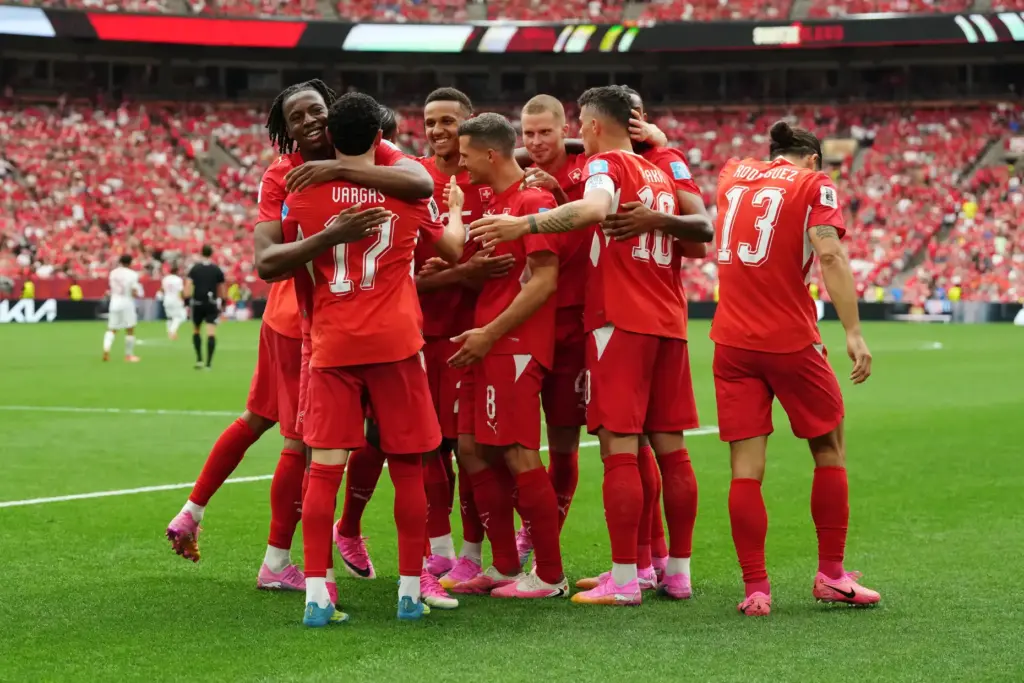Switzerland’s Ruben Vargas (17) is mobbed by teammates after scoring...