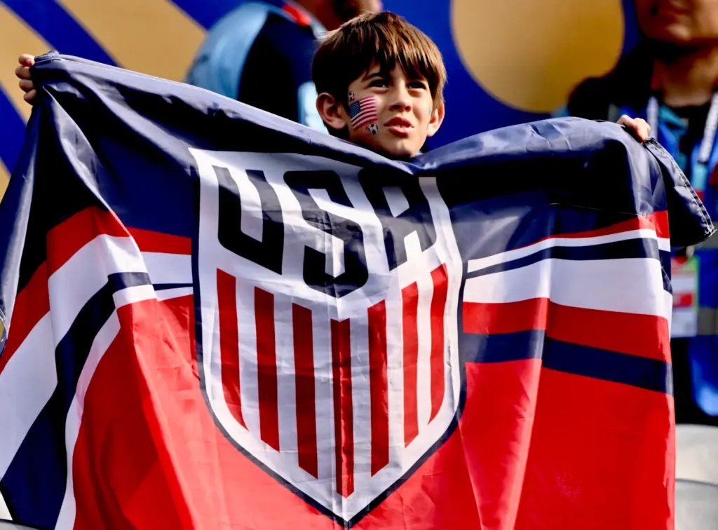 United States Fan waves the flag prior to a FIFA...