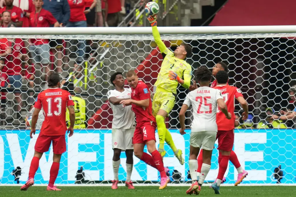 Switzerland goalkeeper Gregor Kobel (1) jumps to make a save...