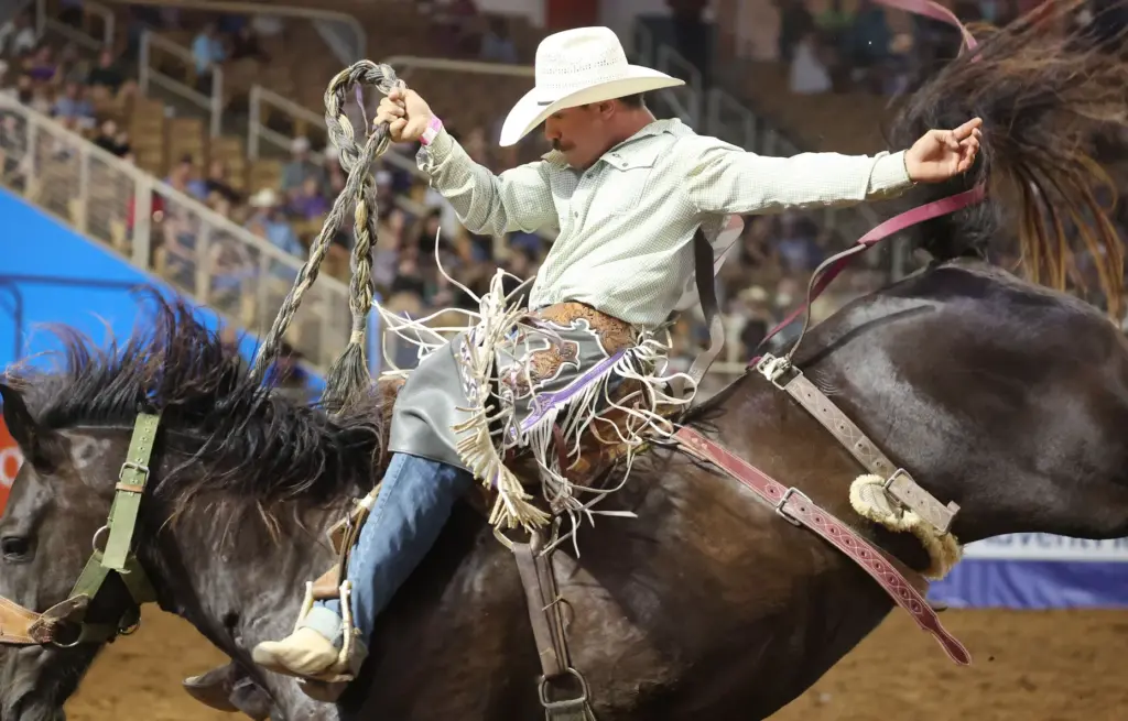 Wyatt Lavergne rides a bucking bronc during the Silver Spurs...