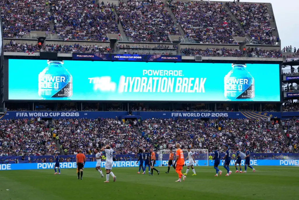 Players take a hydration break during the World Cup match between France and Iraq.